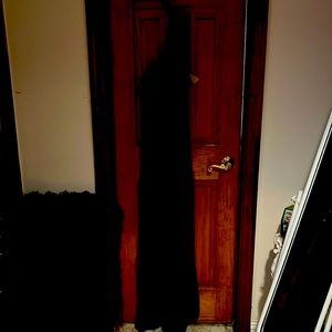 Sleek,full length, with flared skirt at bottom gown. One shoulder, sleeveless.